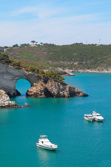 San Felice bay with anchored yachts on Vieste coast, Gargano, Apulia, Italy