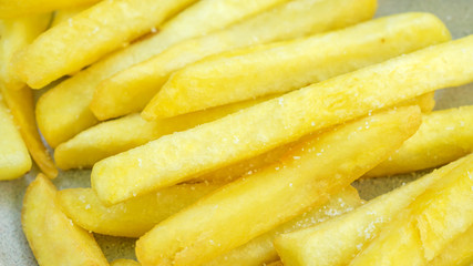 Close up of french fries on a table.
