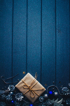 Blue Christmas Background With Gift And Cones