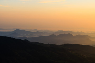 colorful sunrise in the mountain. Silhouette background. warm tone.
