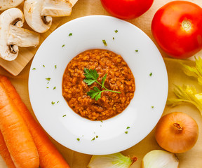 Homemade bolognese sauce with ingredients. Top view.