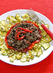 Black risotto made with octopus ink and squid