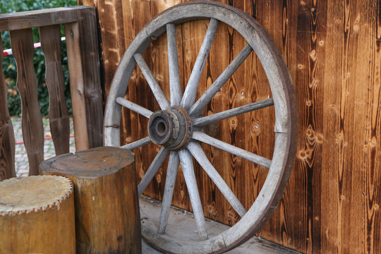 An old wooden wheel from a cart
