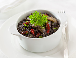 Black rice made with octopus ink and squid