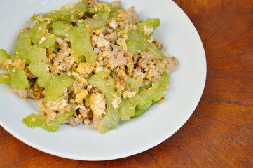 stir fried bitter cucumber with minced pork and egg on plate