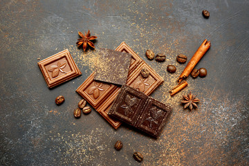 Milk and bitter chocolate with cocoa and spices .Top view.