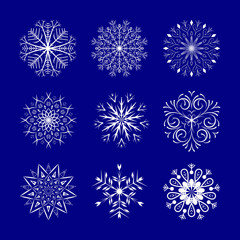 Fototapeta na wymiar Snowflakes set on blue background. Winter Holidays Decorative design elements.