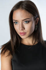 Beautiful young woman in black dress