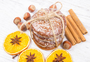 Gingerbread cookies, cinnamon and orange slices. Christmas decoration.