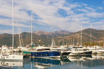 Fototapeta na wymiar View of Porto Montenegro - luxury yacht marina in the Adriatic - on a calm autumn day. Tivat, Montenegro