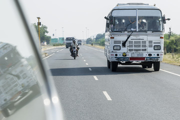 Fototapeta na wymiar Line coach on an Indian highway, Rajasthan, India