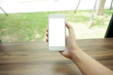 Close up of women's hands holding cell telephone blank copy space screen. smart phone with technology concept.