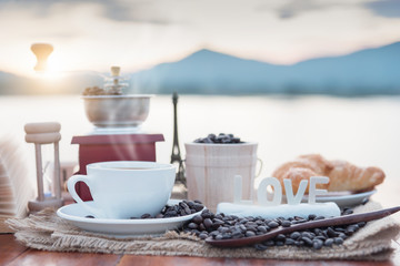 The coffee cup and smoke in morning sunlight