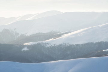 Mountains in the winter time during sunset. Natural landscape in the winter time