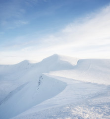 Mountains in the winter time during sunset. Natural landscape in the winter time