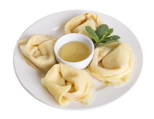 Russian pancakes with honey.