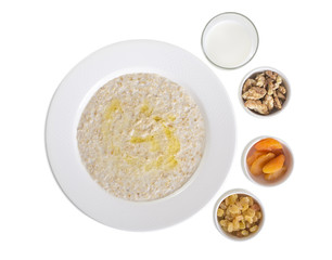 Oatmeal with dried fruits and milk.