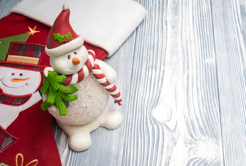 Happy snowman with red sock