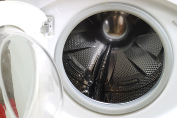 Washing machine for clothes and laundry detergent with rinsing liquid. Container for powder