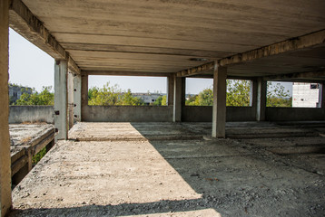 The girl with red hair in an abandoned factory building