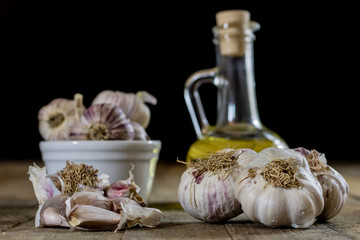 Tasty garlic on a wooden kitchen table. Vegetables in the kitchen atmosphere. Wooden table.