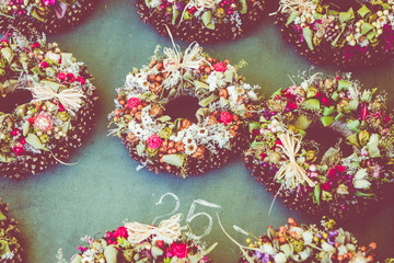 Christmas flowers wreaths decorations in Cracow Christmas market in Poland.