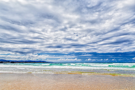 Beautiful contrast clouds in the blue sky on the beach