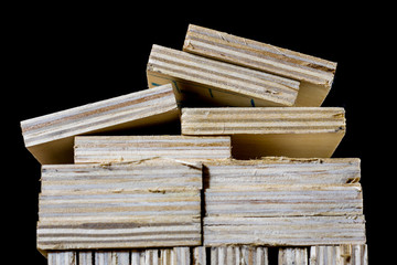 Freshly cut plywood. Plywood strips arranged in stacks. Warehouse with plywood. Materials for carpentry.