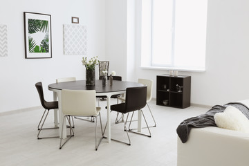Fototapeta na wymiar Modern room interior with big table and chairs