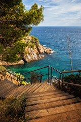 Fototapeta premium Wooden Stairs To The Sea on Costa Brava in Spain