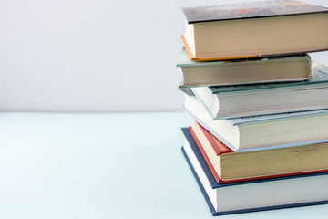 Education concept - books on the gray background 