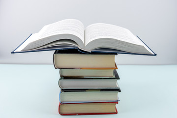 Education concept - books on the gray background 