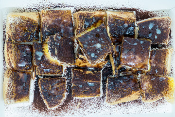 Close up of ovaltine toast with butter and sweetened condensed milk in paper box