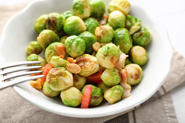 Bowl with brussel sprout salad on table