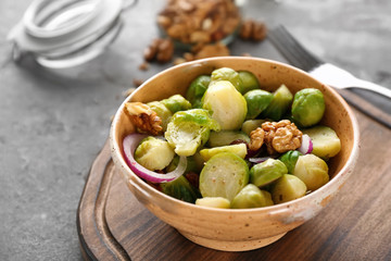 Bowl with brussel sprout salad on table