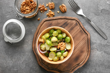 Bowl with brussel sprout salad on table