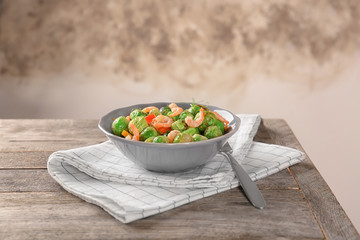 Bowl with brussel sprout salad on table