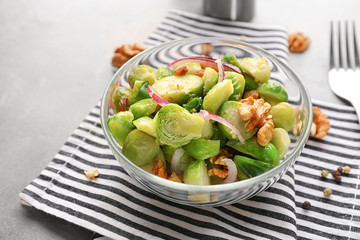 Bowl with brussel sprout salad on table