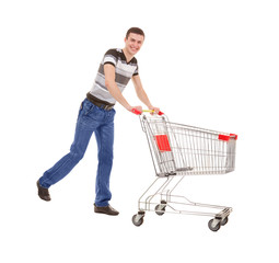 Young Man Running with Empty Shopping Cart on White Background