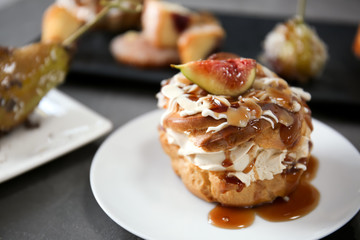Delicious cake with caramel sauce on plate
