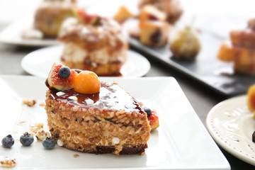 Delicious cake with caramel sauce on plate
