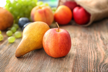 Naklejka na ściany i meble Fresh fruits on wooden table