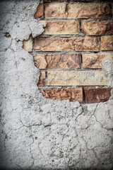 Old rustic plaster and brick wall