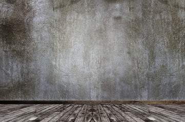 Wooden floor against cement grunge wall