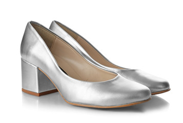 Pair of silver female shoes on white background