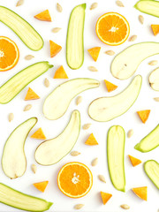 Food pattern of fresh fruit and vegetables in a cut. Sliced pear, orange, zucchini, slices of pumpkin on white background.Composition from fruits, top view, flat lay.