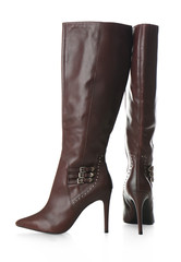 Pair of female high boots on white background