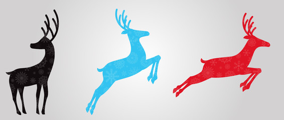 Obraz premium Black, blue and red silhouettes of reindeers