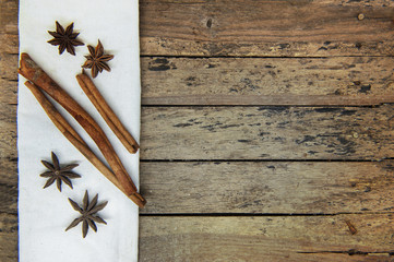 Fototapeta premium Warming spices - cinnamon and star anise on vintage wooden table.
