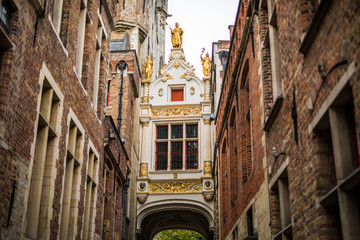 Fototapeta premium Brugge, Belgium - November, 2017. Brugge medieval historic city. Brugge streets and historic center. canals and buildings. Brugge popular touristic destination of Belgium.